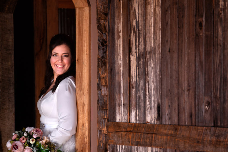 picture of bride in rustic wedding venue